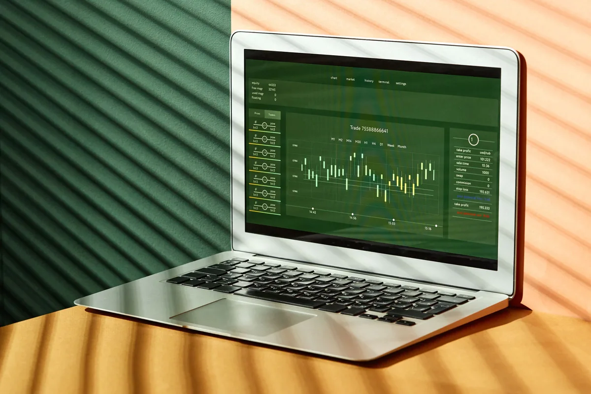 A laptop on a desk showing a business funding dashboard