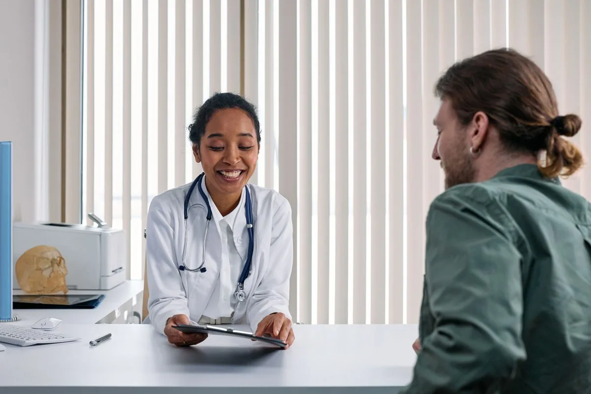 Doctor in a warm consultation with a patient