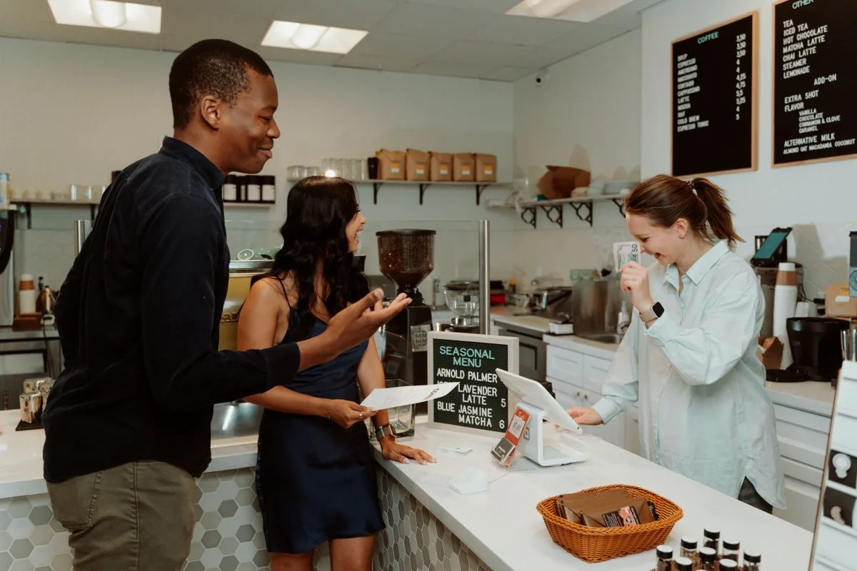Customers at a busy cafe counter